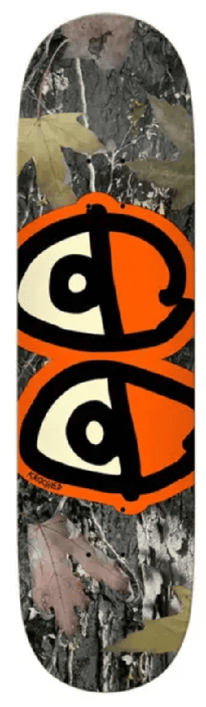 Tabla Krooked Team Eyes Camo con fondo camuflaje y ojos naranjas
